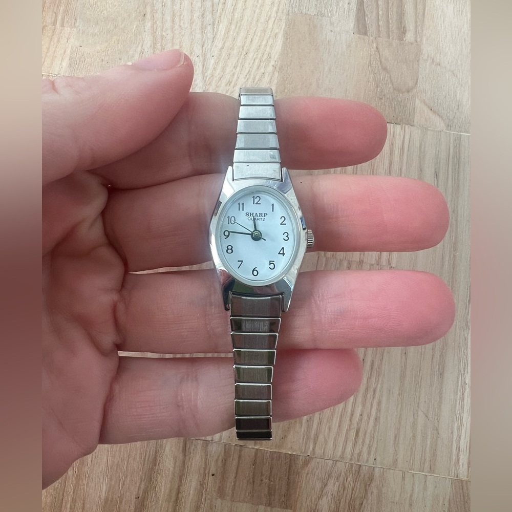 Sharp ladies oval silver tone dress watch NEW BATTERY